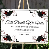 Elegant wedding welcome sign with black and red roses