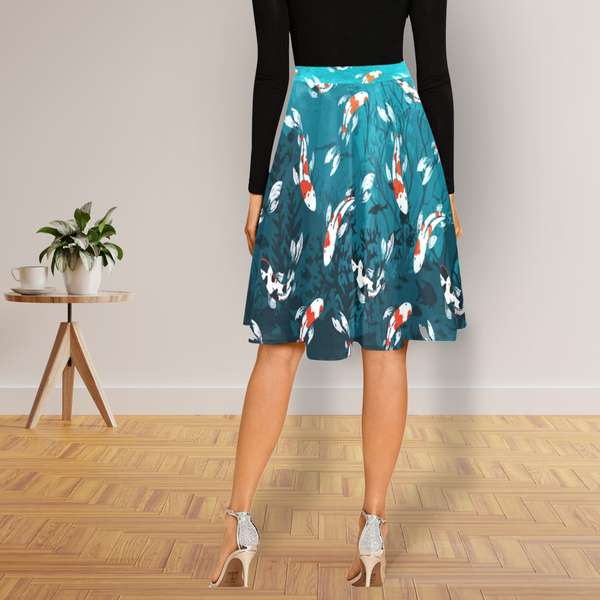 Flaunt marine beauty with our fish-patterned midi skirt.