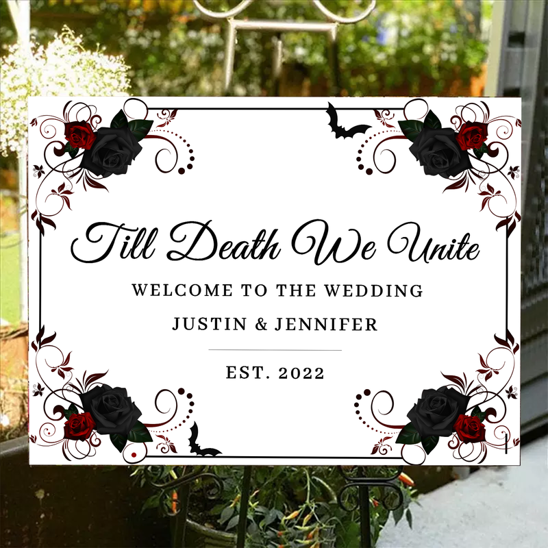 Day-themed wedding entrance decor with black and red roses